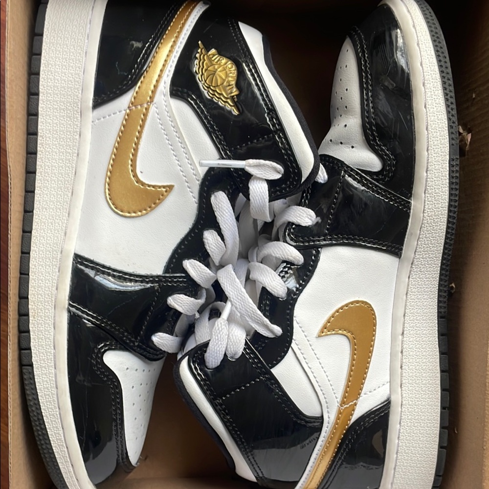 Stylish Black and White High-Top Jordan’s